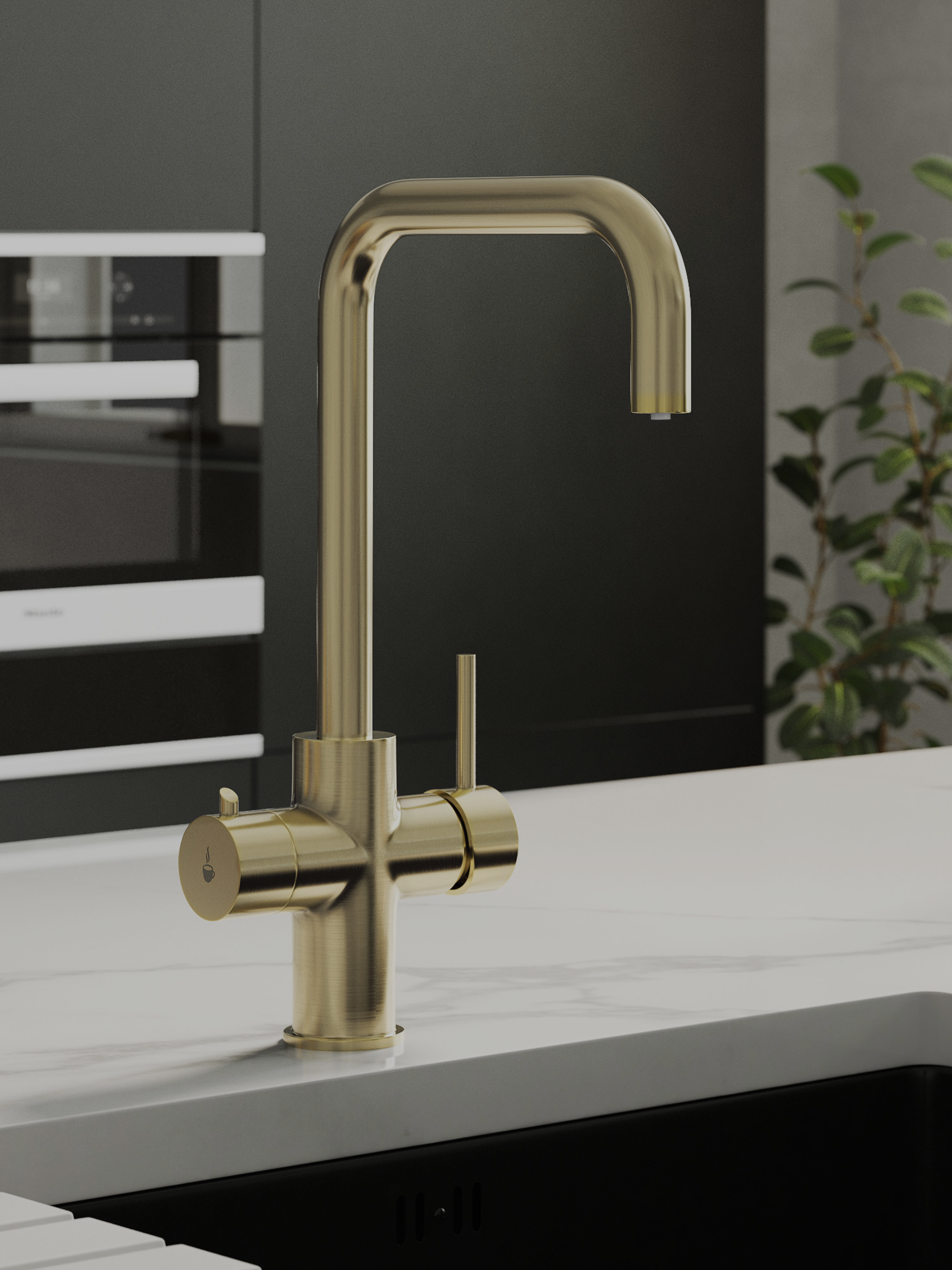A modern boiling water tap in brushed brass, mounted on a white marble countertop