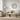 Modern living room with beige sofa, armchair, wooden coffee table and black framed round wall mirror