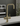 A modern boiling water tap in brushed brass, mounted on a white marble countertop
