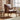 Vintage brown leather armchair with wooden frame in a modern rustic UK living room